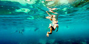 Woman snorkeling in Raya Island,-Thailand.