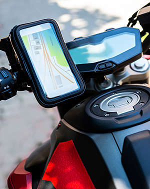Close-up of a navigation tablet on a motorcycle.