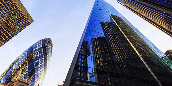 Low-angle view of buildings in London's financial district. 

