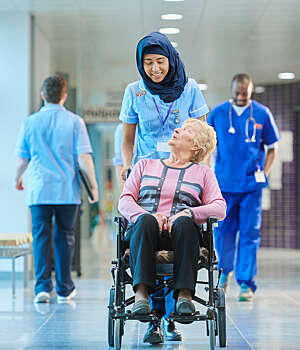 Student nurse with elderly patient.